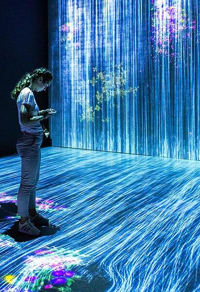 AI representation - person standing in a cascade of code