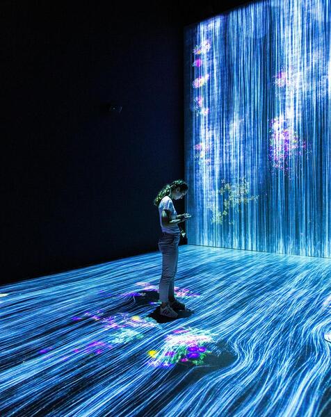 AI representation - person standing in a cascade of code